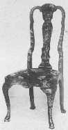 This fine example of a Queen Anne lacquered chair shows
the characteristic splat and top curve, the slip seat narrower at the
back than front with rounded corners, and cabriole legs.