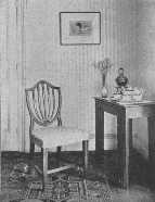 While this nest of mahogany tables is attractive in the
room its appearance in the picture is of an inappropriate and heavy
mission table.